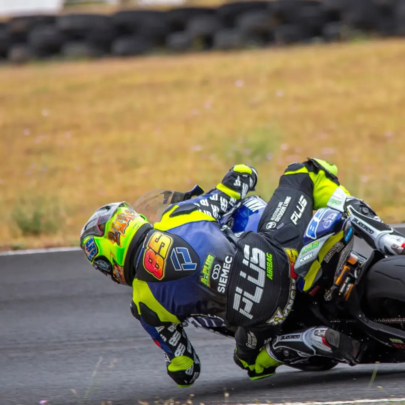 Rider hard on the knee through a corner on the Yamaha R1